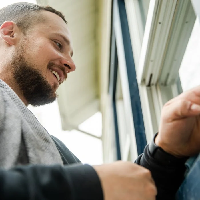 Window cleaning on residential home in Grand Haven