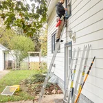 Clean windows on Grand Haven home